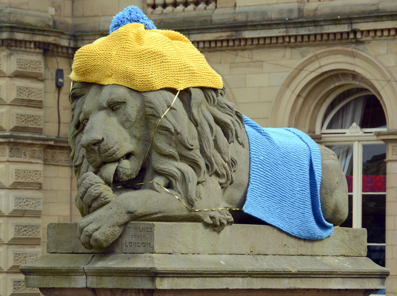 2025.68.35: Saltaire Tour de Yorkshire Decorated Lion (licking its paw). Digital image credit: Saltaire Collection
