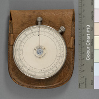 B1-087.1: Fowler Textile Calculator with Leather case: Calculator laid on its case. Image credit: Saltaire Collection