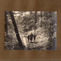 F1a-134: Northcliffe Woods 1920: Page 5 - Woman and 2 children wlaking through Northcliffe Woods. Image credit: Saltaire Collection